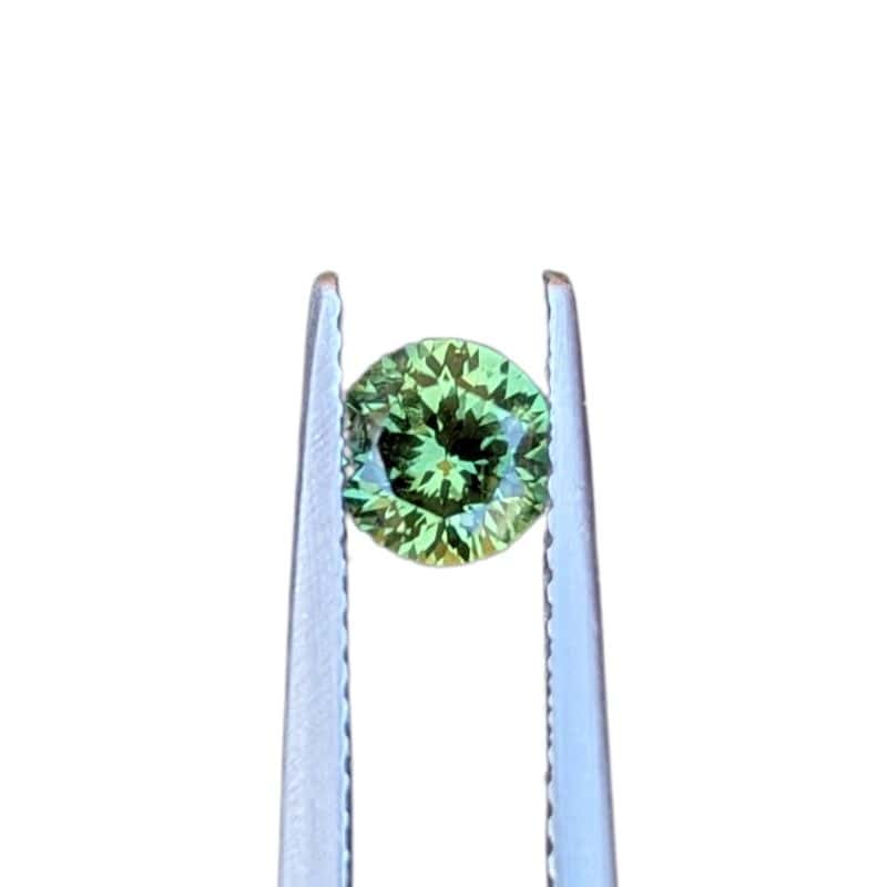 0.81ct round portuguese cut green australian sapphire