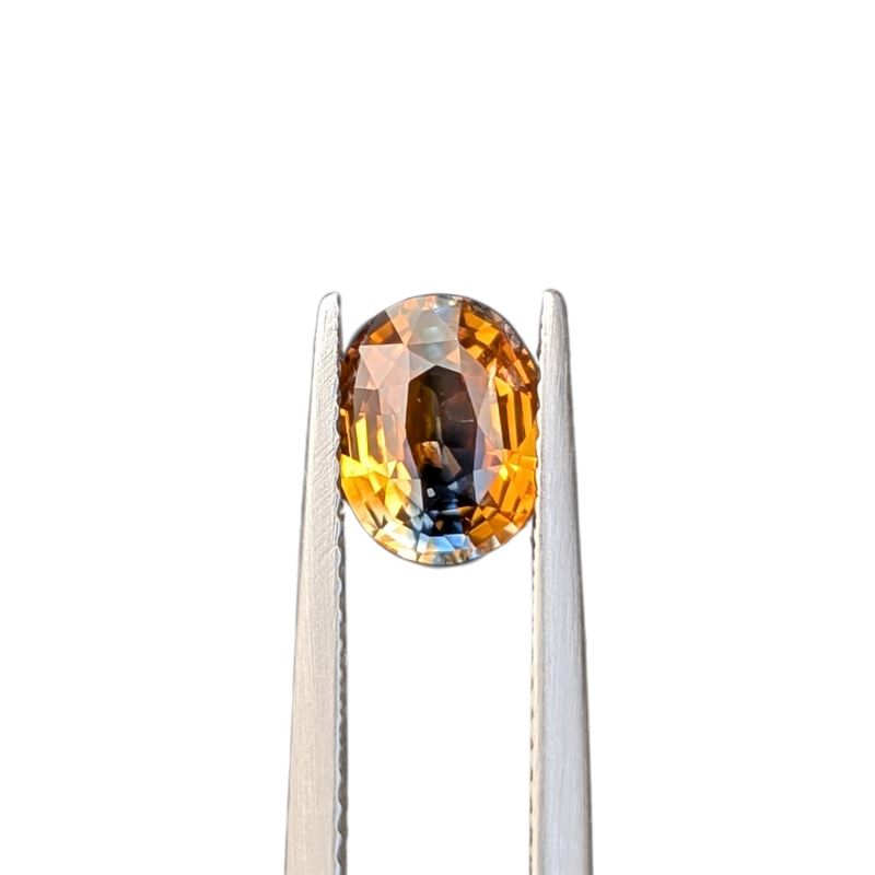 1.59ct oval cut orange blue madagascan sapphire
